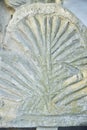 An ancient stone slab from ancient Greek times with a pattern or bas-relief Royalty Free Stock Photo
