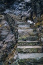 Ancient stone stairs going up on black rock, mountain stairway. Norway, Trolls road, Trollstigen. Royalty Free Stock Photo