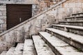 Street detail with stone stairs and wooden church door in town of Vis, Croatia Royalty Free Stock Photo