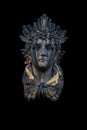 An ancient stone statue of God of Sun and sight Helios Helius. Fragment of an ancient statue.  Often he is depicted with a Royalty Free Stock Photo