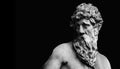Ancient stone statue of Hercules against black background. Power, strength and courage concept. Black and white image. Copy space Royalty Free Stock Photo