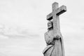 Ancient stone  statue of Jesus Christ with cross Royalty Free Stock Photo