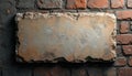 Ancient stone tablet on brick wall background for text mockup. Empty rock plaque with rough, broken edges, copy space. Weathered Royalty Free Stock Photo