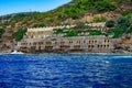 Ancient stone wall with arched holes on a flooded beach in Emirgan Ulas Mesire Yeri park in Alanya Turkey. Exotic tropical