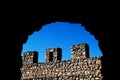 Ancient stone wall with battlements Royalty Free Stock Photo