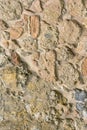 Ancient stone wall. Masonry of beige old stones and bricks. Beautiful background. Royalty Free Stock Photo