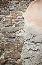 Ancient stone wall. Ruin. Gray stone background. Wall with peeling plaster Royalty Free Stock Photo