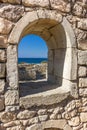 Ancient stone wall with a semicircular window Royalty Free Stock Photo