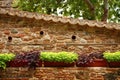 Ancient stone wall with tiled roof Royalty Free Stock Photo