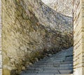 Ancient stone wall, winding stone staircase, upstairs
