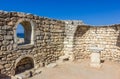 Ancient stone wall with a window and a view of the sea Royalty Free Stock Photo