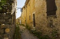 Ancient stone walls and narrow gravel streets in the historic French village of Le Poet Laval in the Drome area of Provence