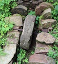 Ancient stone wheel of abandoned water mill to grind flour