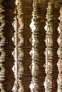 Ancient stone window pillars balusters close up temple architecture detail geometric shape light shadow historic structure Royalty Free Stock Photo