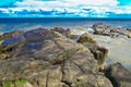 Wonderful spring landscape. Ancient stones from red granite adorn the sandy bank of the Dnieper River in Ukraine Royalty Free Stock Photo