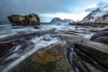 Ancient stones on the shores of cold Norwegian Sea at evening time. Lofoten islands. Beautiful Norway landscape. Royalty Free Stock Photo