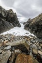 Ancient stones on the shores of cold Norwegian Sea at evening time. Lofoten islands. Beautiful Norway landscape. Royalty Free Stock Photo