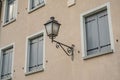 Ancient street lamp detail on the facade of the building Royalty Free Stock Photo