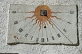 Ancient sundial with signs of the zodiac on white wall Royalty Free Stock Photo