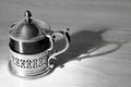 An ancient tea-pot black and white with his shadow Royalty Free Stock Photo