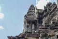 Ancient temple Angkor Wat entrance view. Buddhist or hindu temple Angkor Wat on sky background. Royalty Free Stock Photo