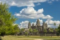 Ancient temple Angkor wat on a sunny day with blue skay and man