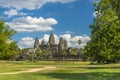 Ancient temple Angkor wat on a sunny day with blue skay and man