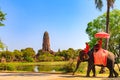 AYUTTHAYA, THAILAND - JANUARY 23, 2019 : Tourist takes an elephant ride around historic site at Wat Phra Ram, Ayutthaya Royalty Free Stock Photo