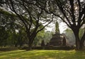 Ancient temple and big trees in the Sukhothai Historical Park, T Royalty Free Stock Photo