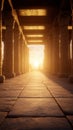 Ancient temple corridor with sunset glow and stone pillars Royalty Free Stock Photo