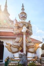 Ancient temple guardian in front of Temple of Dawn Wat Arun Buddhist Temple is white demon giant statue named Sahatsadecha.
