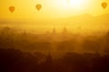 Ancient temple and hot air balloon fly over sky in Bagan after sunrise Royalty Free Stock Photo