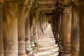 Ancient Temple Pillars Under a Walkway in Angkor Thom, Cambodia Royalty Free Stock Photo