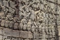 Ancient temple stone carved bas-relief in Angkor Wat. Army in boat bas-relief closeup. Angkor Wat complex Bayon temple Royalty Free Stock Photo