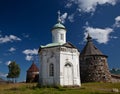 Ancient temple and the towers of the Solovetsky Monastery against the blue sky