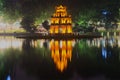 Ancient Temple of Turtles on the background of the waterfront Hoan Kiem lake in the night illumination. Hanoi