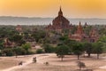 Ancient temples and carriages at sunset in Bagan, Myanmar. Royalty Free Stock Photo