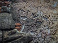 ancient textured stone wall of ruins in Ayutthaya, Thailand