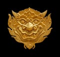 Ancient Thai art golden lion-singha isolated on black background Royalty Free Stock Photo