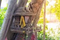 Ancient Thai outdoor spirit house shrine Thai style made from wood.