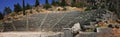 A panoramic view of the ancient theater in the famous archaeological site of Delphi in Greece Royalty Free Stock Photo