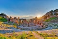 Ancient theatre of Taormina with Etna erupting volcano at sunset Royalty Free Stock Photo