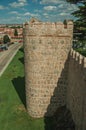 Ancient thick wall with battlement and large towers at Avila