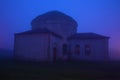 Ancient Three-Sainted church in a winter fog. Sheki, Azerbaijan