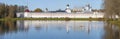 At the ancient Tikhvin Assumption Monastery on a sunny October day. View from the Tabory lake