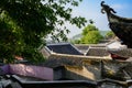 Ancient tile-roofed buildings in sunny spring morning