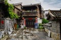 Ancient tile-roofed house in cloudy spring afternoon