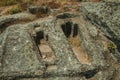 Ancient tombs for child and adult carved in stone near Monsanto Royalty Free Stock Photo