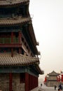 Ancient tower in a fog day in xian city wall with pagodas Royalty Free Stock Photo