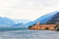 Ancient tower and fortress in old town Malcesine at Garda Lake. Mountains with clody sky in the background. Italian landscape. Royalty Free Stock Photo